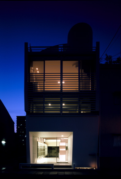 Mo House This house is situated in relatively high-density urban context consisting mixed residential/commercial use. It sits on a narrow site measuring approximately 59m2. The shop on the ground floor is visually connected to the courtyard at the rear. The residential part is situated on the upper floor. <br />I have taken in account the geographic feature of Kobe when designing this house. North and South façades are double-glazed, providing the views of mountain and sea. These openings and the courtyard efficiently provide the natural lighting and the ventilation into the internal space. Private areas are placed on the first floor and the living room is located on the second floor. The layout is carefully considered so that spatial volume and the brightness increase as one proceeds to the higher floor. The roof top terrace comprises sanitary space and it acts as the sky garden that offers the view of sky, mountain and sea.<br />The reason I’m attracted to steel as building material is for its unlimited possibilities. I’m convinced that it goes beyond the structural limitation that has been established during the modernist age. In addition to its structural durability, I also consider steel as a high quality external cladding material.<br />I chose to use 9mm steel sheet not only for its texture and durability but also for the impression it can give of being thin. I believe the texture of steel, like the texture of thick stone in Mies’s architecture, can create the impression of reliability and sophistication.<br />For instance, a car needs to be light and durable, but texture of thin steel sheet wrapped around it is never considered as important as it is in architecture. The application of steel in architecture is not only about the manufacturing process in factory. The thinness of the material changes according to the size of the space and it will affect the impression and the texture. The reason I’m being particular about the texture is because architecture is not merely used, but also is lived in.<br />