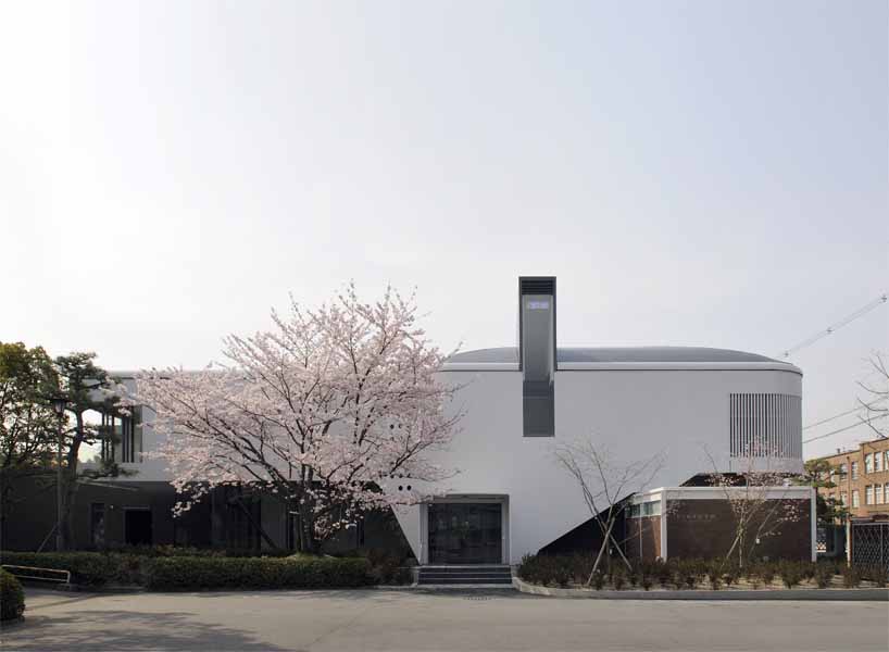 Kyoto Institute of Technology '60th Anniversary Hall' The ‘60th Memorial Hall stands symbolically before the main entrance of the University. The building is located along the axis of existing school building, leaving space for existing trees planted along the street. The ground floor consists of the memorial hall, lecture hall and a gallery. The first floor consists of big and small seminar rooms and a foyer. A part of school’s external wall has been removed so that the building could have a direct access from outside and be open to public. <br />I have chosen “time” as the main theme of this memorial hall, and tried to design “a space that captures time, and let us re-cognize the past.” In other words, in architecture, some concept and techniques are inherited from the past while some gets lost. Architecture consists of many aspects such as sensitivity, memory and symbolism. <br />The original school buildings were designed by Seigo Motono and were made of massive reinforced concrete. It was the style that once called “architecture of new generation”. It somewhat reminded me of the transparency of Fagus Factory and Bauhaus building designed by W. Gropius. It was an ideal image of a University of the time and a figure of future design school with countless possibilities for modern design. <br /> They say contemporary architecture is fading. However, works of unknown artisans give life to architecture. As we walk through a building, it stimulates our senses, touches our heart, and gives sense of respect. Great buildings I have encountered till now have always transmitted these kind of feeling directly to my body. This kind of buildings deserves to be left as a heritage. Design process of this building made me caught up in such thought. <br />I deliberately chose details and materials for the new memorial hall and decided to use steel as a “contemporary” material in contrast with old school building designed by Seigo Motono.<br />